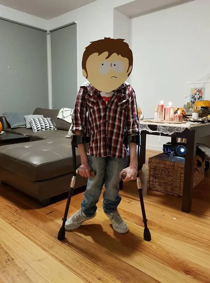 A man wearing a funny baby carrier illusion dress as a clever Halloween costume idea