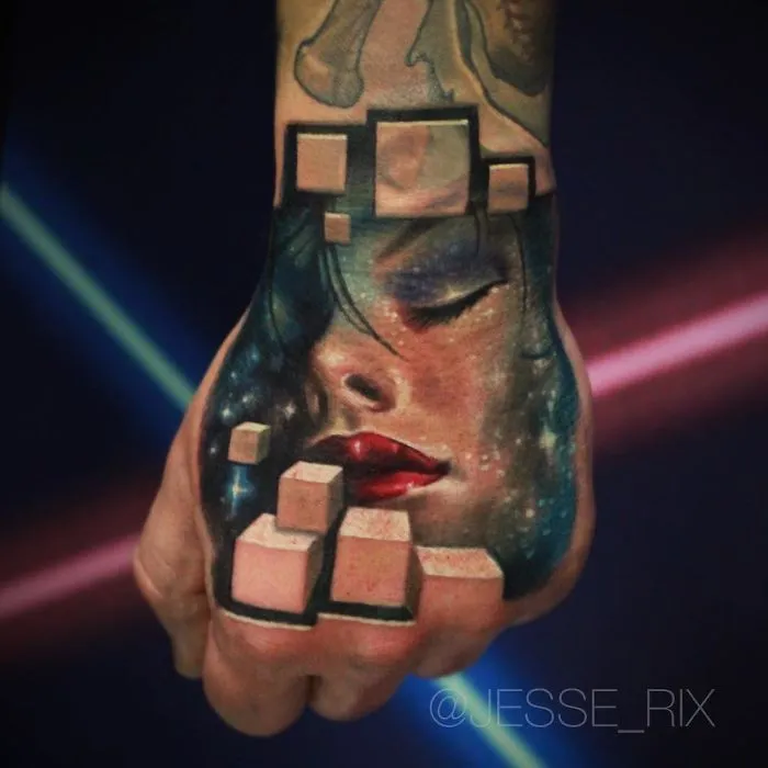 3D tattoo of a woman's face with cubes on a hand, showcasing vibrant, lifelike artistry.