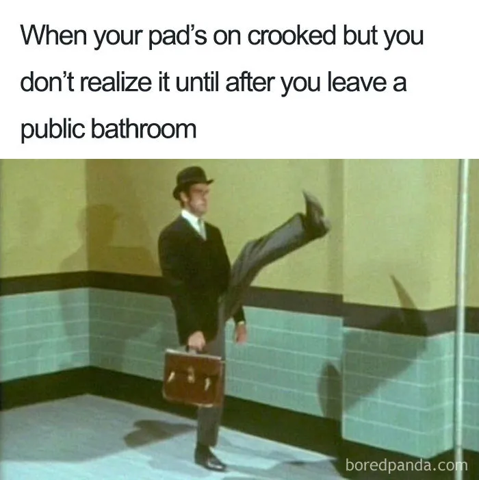 Man humorously walking with a briefcase, illustrating a "when she's on her period" meme about a crooked pad.