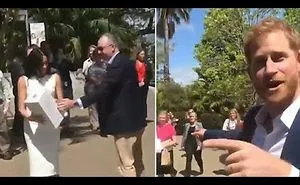 Prince Harry Reacts When Meghan Is Handed A Huge Bouquet Of Flowers