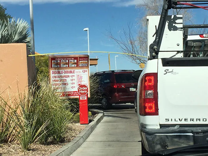 Bored In Line, These Construction Workers Tried To See What They Could Reach With Their Measuring Tape