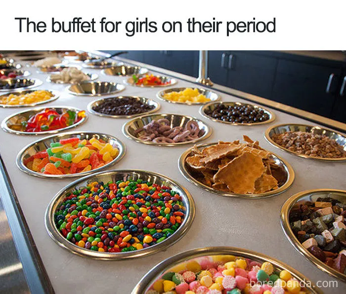 Buffet of snacks and sweets, humorously labeled for periods.