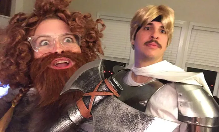 Couples Halloween costume ideas featuring a man in armor and a woman as a bearded warrior with an axe