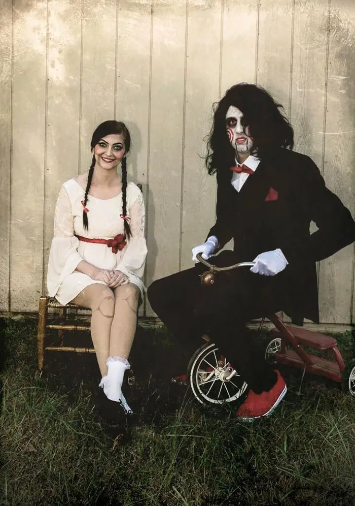 Scary couples halloween costume ideas with Annabelle and Billy the Puppet on a tricycle