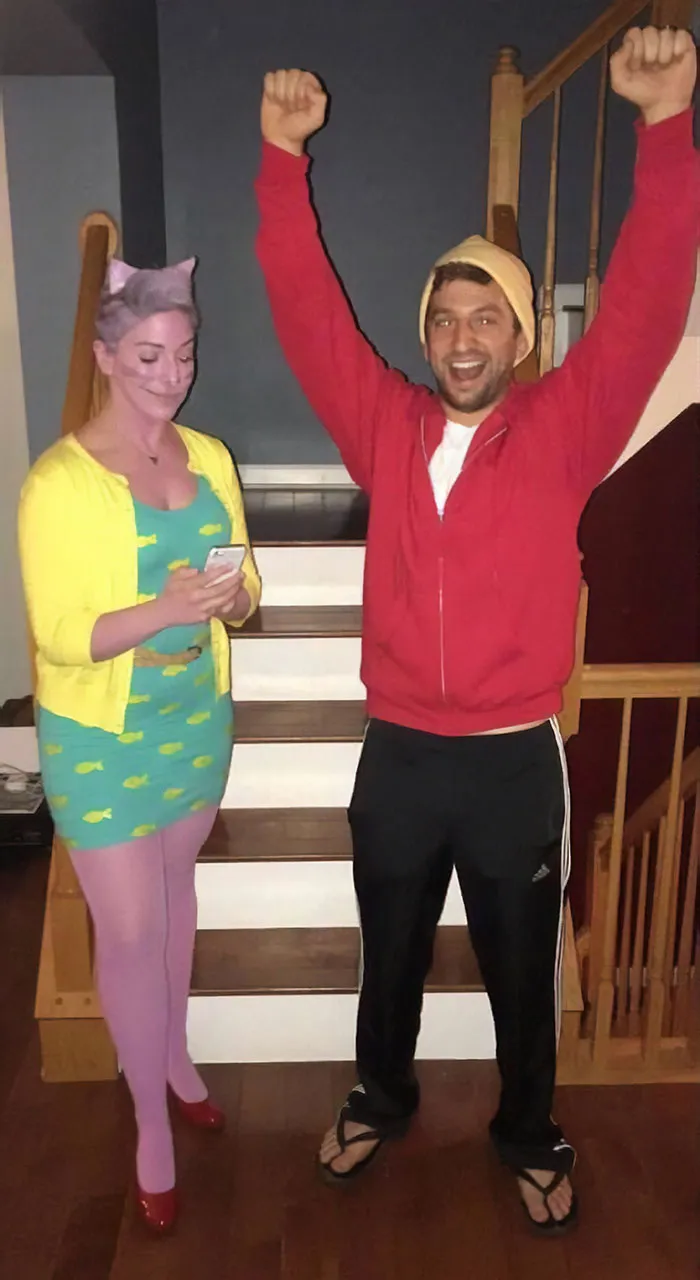 A man and woman posing indoors as Princess Carolyn and Todd, a fun couples Halloween costume choice.