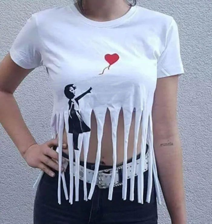 A person wearing a Banksy shredded shirt, showcasing a unique and clever Halloween costume idea.