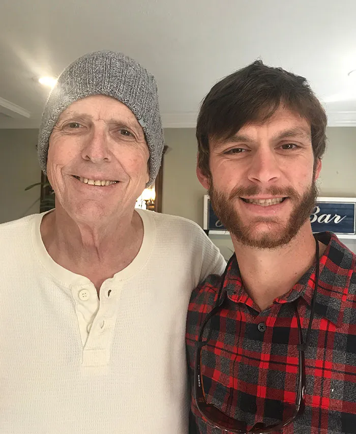 Dad and his son posing for a selfie 