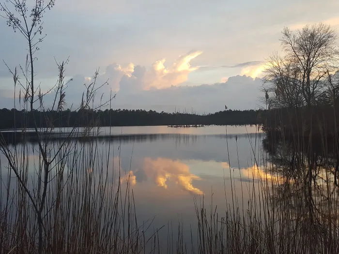 Sunset Reflections Of Moving Clouds