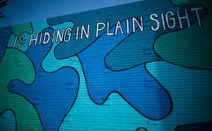 There’s Inexplicable Blue Camouflage Popping Up On Walls All Over Los Angeles, And I’m Here For It.