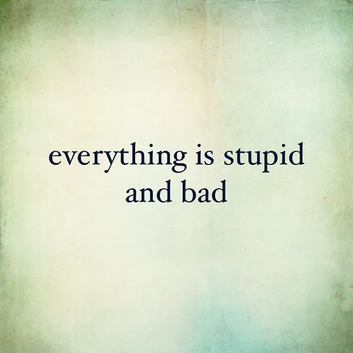 Pessimistic Instagram quote on a faded background saying everything is stupid and bad, showcasing unispirational humor.