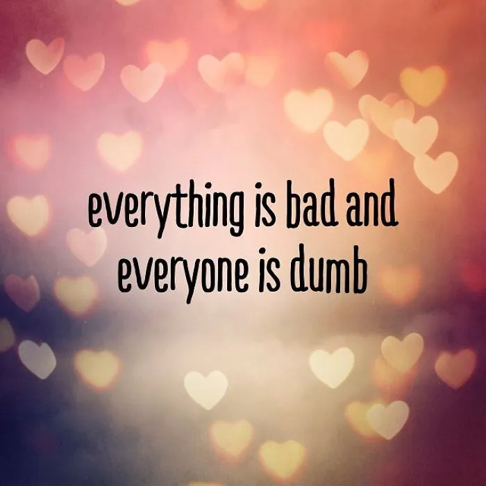 Unispirational quote on blurred heart background expressing pessimistic Instagram humor and negativity in a colorful bokeh style.