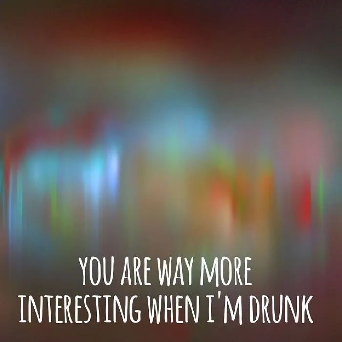 Hilariously unispirational quote on a blurred colorful background about being more interesting when drunk.