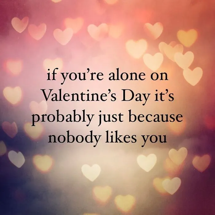 Pessimistic Instagram quote on Valentine’s Day about being alone because nobody likes you with heart-shaped bokeh background.