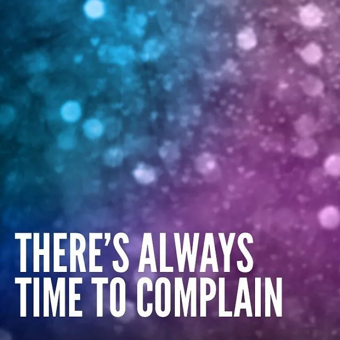 Background with blue and purple bokeh and the pessimistic Instagram quote saying there’s always time to complain.