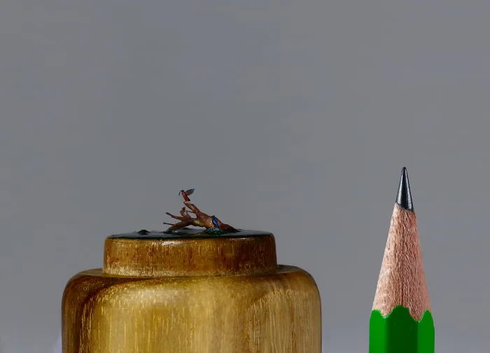 Mini Kingfishers On The Wooden Base