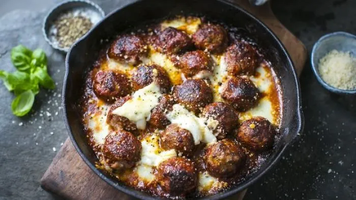 These Meatballs Coated With Tomato Sauce And Mozzarella Are Simply Spectacular