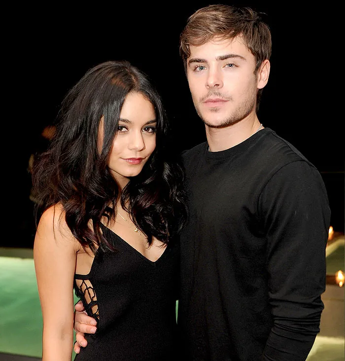 Young celebrities posing together at an event, showcasing couples who fell in love while acting together.