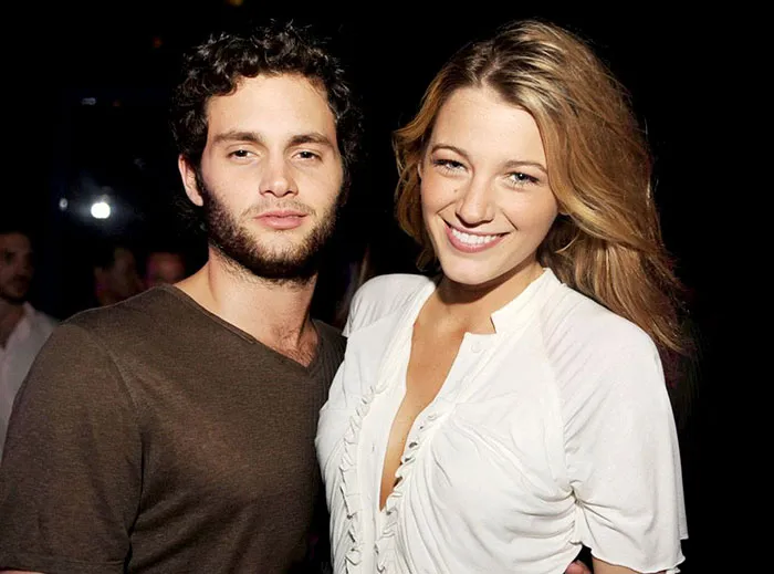 Young celebrities posing together at an event, representing couples who fell in love while acting together.