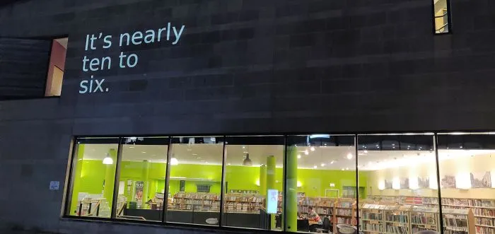 This Library Has The Approximate Time In Words Projected Onto It