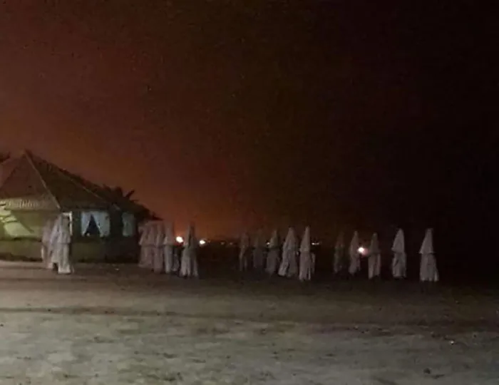 You Get Afraid Thinking These Are Ku Klux Klan Members Until You Realize They Are Only Closed Parasols In The Beach