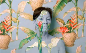 Artist Paints Her Body And Makes It Disappear Into Floral Backgrounds