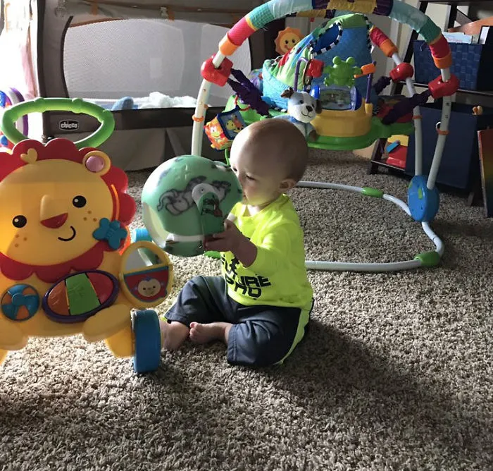 My Son Playing With His Helmet