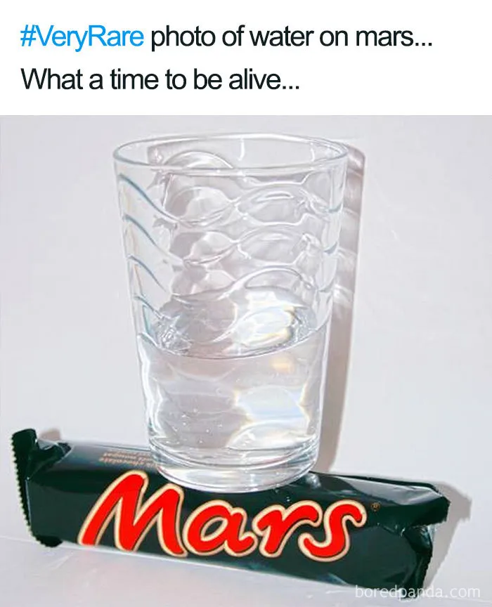 Glass of water placed on a Mars bar, humorously depicting "water on Mars" in a space meme.