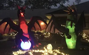 Neighbors Are Saying This Woman's Christmas Dragon Decorations Are Inappropriate, So She 'Fixes' It
