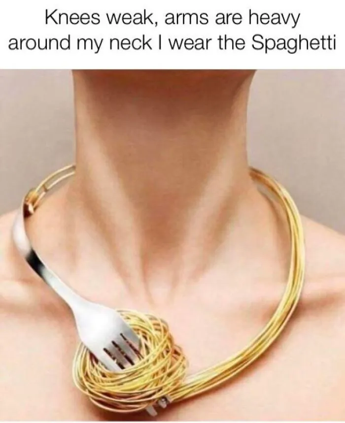 Person wearing spaghetti and fork necklace, showcasing a fashion disaster turned hilarious meme.