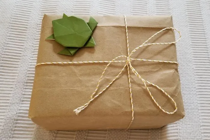 I'm Never Going Back To Wrapping Paper! Used A Grocery Bag And Some String And Decided To Add An Origami Cutie To The Top