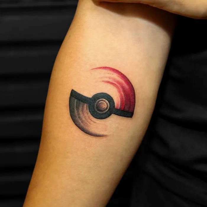 Innovative black and red tattoo design on forearm for ink lover.
