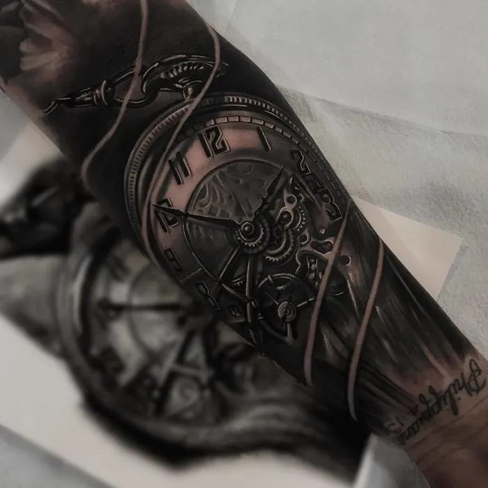Realistic clock tattoo design on forearm with intricate details and shading. Perfect inspiration for ink lovers.