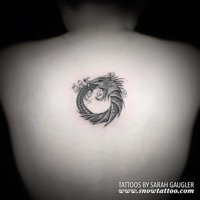 Intricate dragon tattoo on back, showcasing detailed artistry for every ink lover seeking unique tattoo ideas.