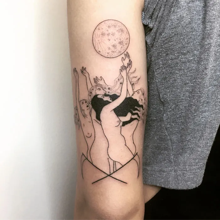 Arm tattoo featuring mystical figures reaching towards a moon, perfect for ink lovers.