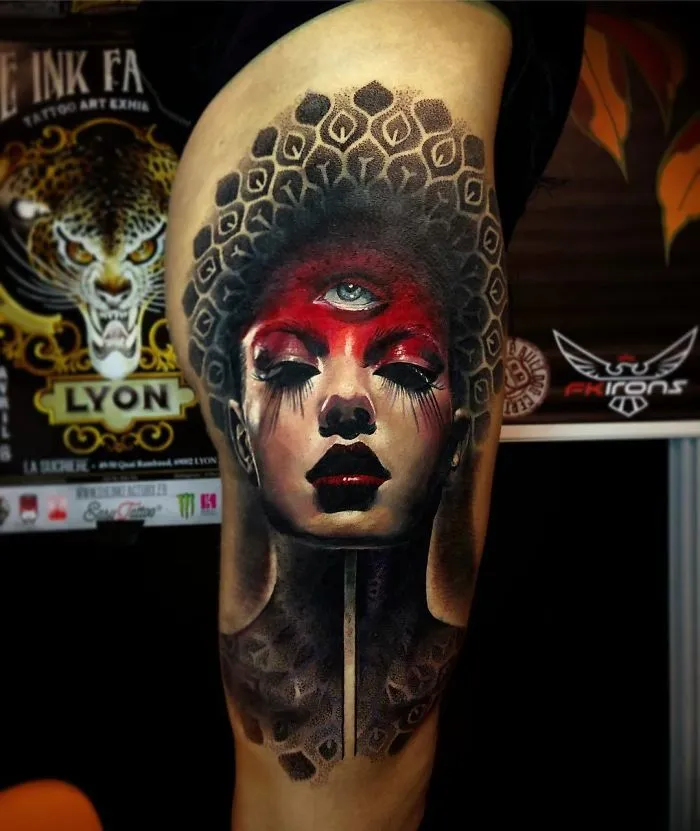 Abstract face tattoo design featuring vibrant colors and intricate patterns for ink lovers.