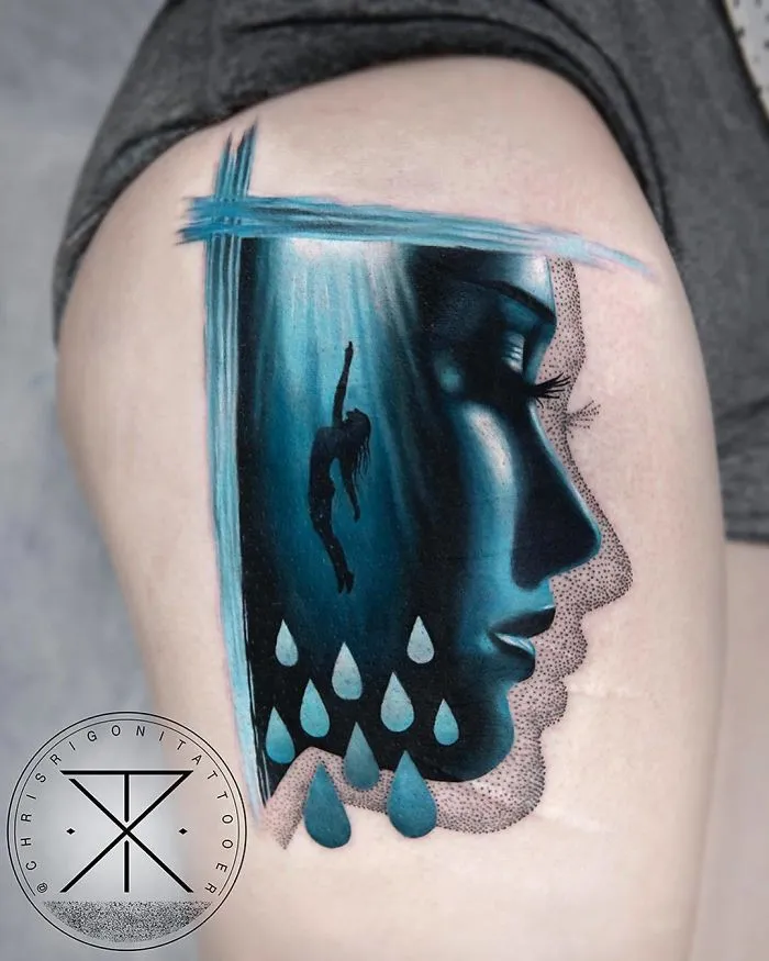 Innovative tattoo featuring a silhouette swimmer and teardrop design, perfect for every ink lover seeking unique ideas.