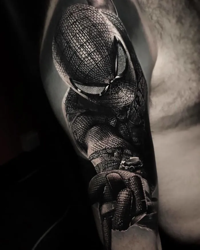 Arm sleeve showcasing a detailed superhero tattoo design for ink lovers.