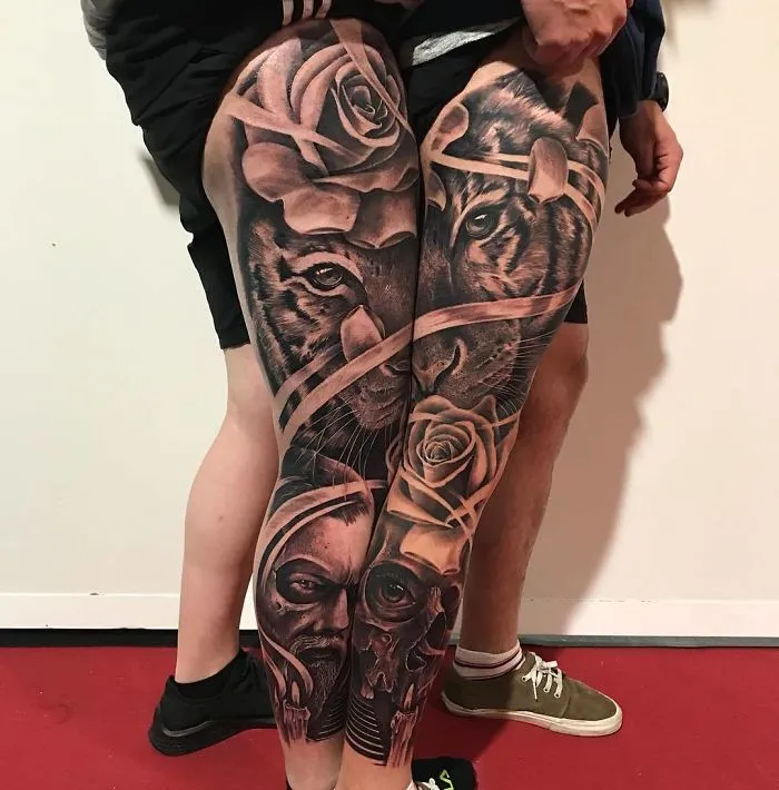 Tattoos featuring lions, roses, and skulls on legs, ideal tattoo ideas for every ink lover.