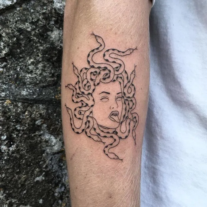 Medusa tattoo design on a forearm, featuring intricate snake hair for ink lover ideas.