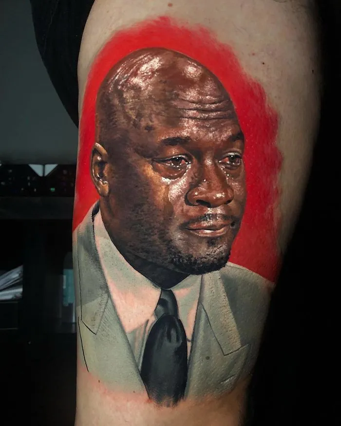 Portrait tattoo of a man's face in a detailed, realistic style on an arm, perfect for ink enthusiasts.