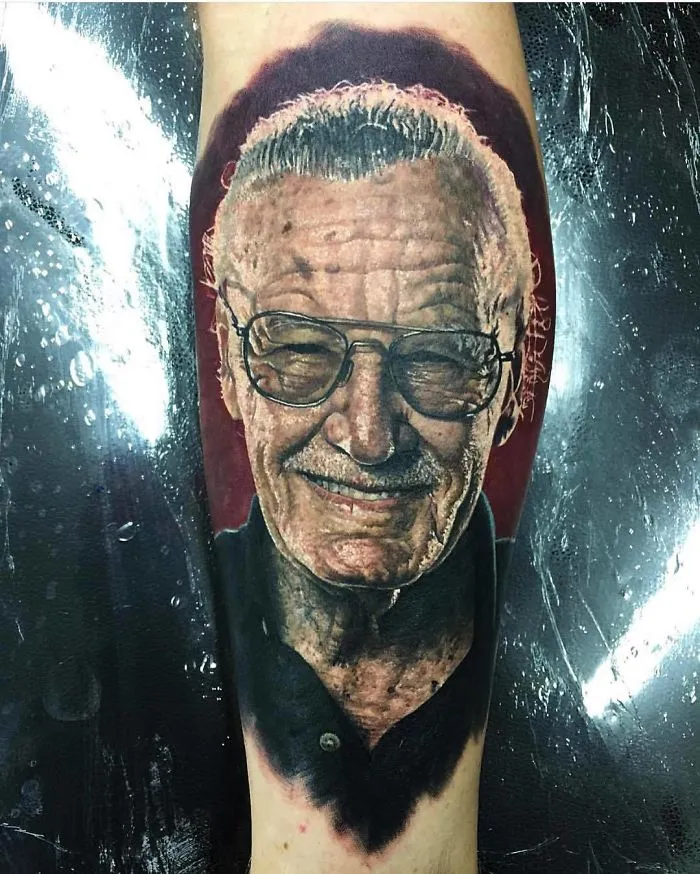 Portrait tattoo of an elderly man with glasses for ink lovers, showcasing realistic detail.