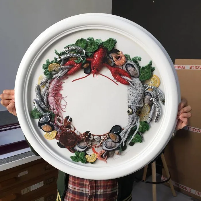 So Here's A Picture So You Can See The Size Of The Wreath. I Will Only Be Making 12 Of These So Please Get In Touch If You Are Interested. It Is A Giclee Print With Knitted And Crocheted Elements Hand Stitched Onto The Print Including Knitted Anchovies, Lemon Slices, Parsley, Prawn, Mussels And Octopus Tentacles £650.00 I Ship Worldwide So Please Get In Touch If You Are Interested. #katejenkinsstudio #britishartist #fishmaswreath #editionof12
