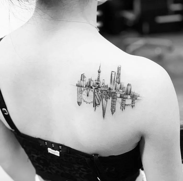 Skyline tattoo on woman's back, showcasing creative ink ideas for tattoo lovers.