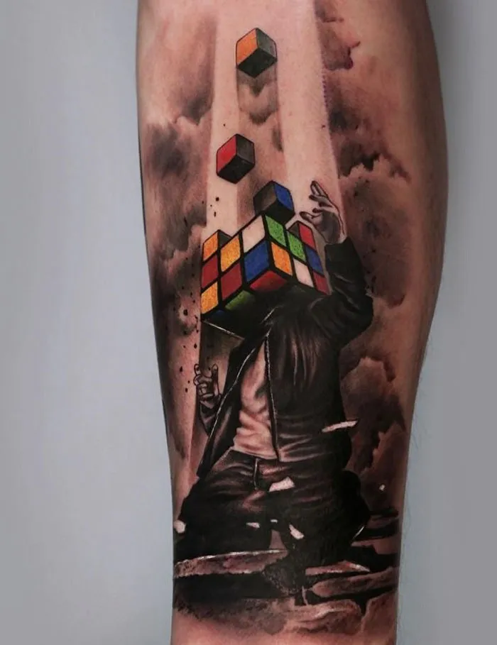 Abstract tattoos of Rubik's cubes and a figure in motion, perfect ink ideas for every tattoo lover.