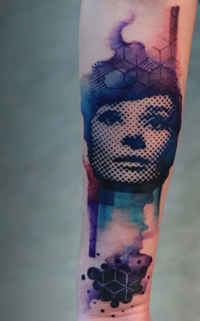Abstract tattoo with geometric shapes and a dotwork portrait on forearm, perfect for ink lovers seeking unique designs.