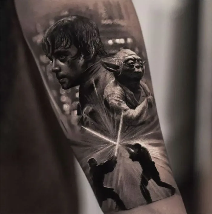 Star Wars tattoo featuring characters and lightsaber duel for ink lovers.