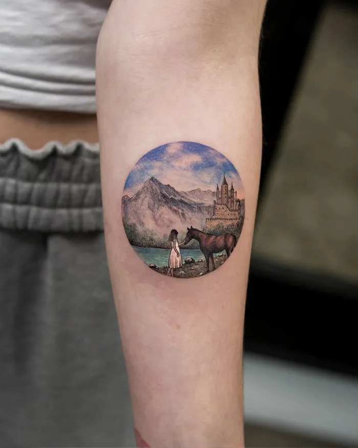 Circular tattoo with a landscape, featuring a woman with a horse and a castle in the background. Perfect for ink lovers.