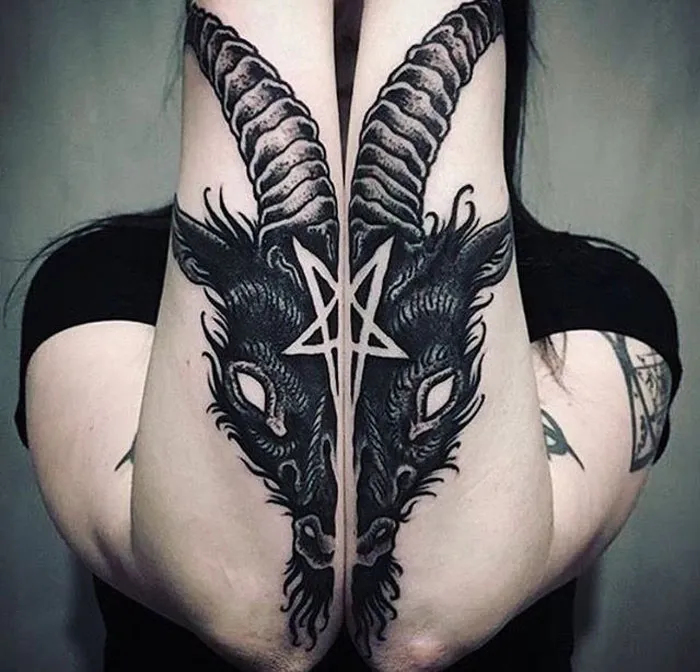 Two forearm tattoos featuring symmetrical goat heads with horns for ink lover.