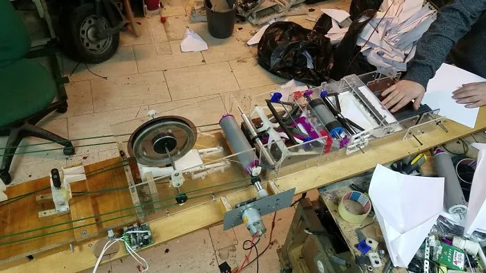 Turned Five Old Printers Into A Paper Airplane Folding Machine