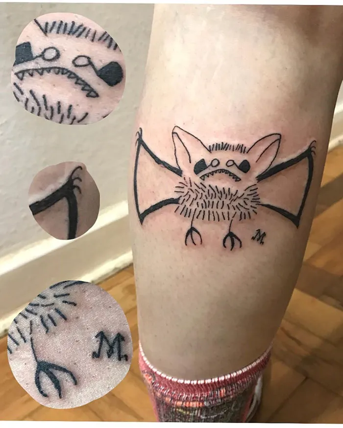 Unique bat tattoo design on leg by artist known for unconventional drawing style, featuring close-up details.